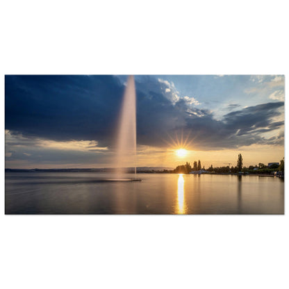 Leinwand Wasserfontäne am Zugersee bei Sonnenuntergang